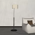 Modern Floor Lamp with Black Pole and White Shade by Beige Sofa and Gray Wall