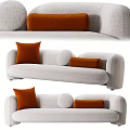 Modern Multi Seater Sofa With Soft Bouclé Upholstery And Orange Accent Pillows