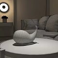 Whale Shaped White Decorative Lamp on Marble Coffee Table in Modern Living Room with Sofa