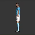 Man in Manchester City Blue Shirt White Shorts Number 2 with Blue Socks Grey Background