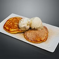 Fluffy Golden Pancakes With Two Scoops Of Ice Cream On White Ceramic Plate