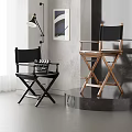 Modern Black and Wooden Dining Chairs with Cross-Legged Design in Minimalist Grey Interior Space