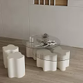 Modern Glass Top Coffee Table With White Wave Shaped Base And Stools 3d model
