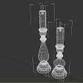 Two Ornate Black Candle Holders With White Candles And Classic Bases For Home Decor