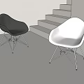 Modern Black and White Leisure Chairs with Metal Wire Legs in Staircase Background