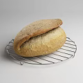 Fresh Homemade Bread Sliced Round Half Loaf on Wooden Board Cloth Metal Rack