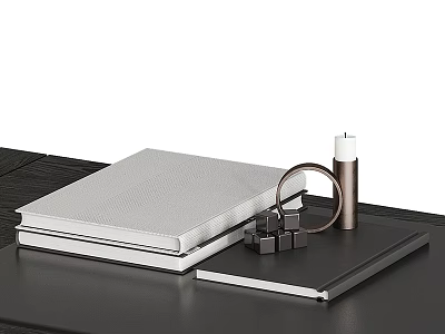 Decorative Ornament Set With White Covered Books Metal Ring Cube And Candle On Black Tabletop 3d model