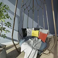 Indoor Hanging Chair With Metal Frame Woven Design Blue Cushion Colorful Pillows And Green Plant