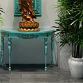 Elegant Console Table with Golden Guanyin Statue and Blue Carved Backdrop Flanked by Green Plants