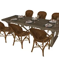 Vintage Wooden Dining Table Set With Rattan Chairs And Place Settings