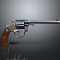 Classic Silver Revolver With Brown Wooden Grip And Shiny Metal Barrel