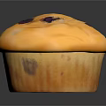 Golden Blueberry Muffin With Purple Spots And Soft Texture On Dark Surface