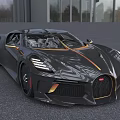 Black Luxury Sports Car With Gold Accents And Sleek Aerodynamic Design