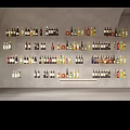 Wine Bottles and Glasses Collection Arranged Neatly on Wall
