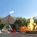 Cozy Outdoor Living Space With Tent Fire Pit Green Plants Flowers Mats Blankets And Furniture