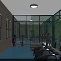 Gym Building with Glass Structure and Indoor Workout Equipment Surrounded by Green Trees