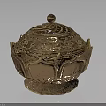 Decorative Golden Furniture Piece With Intricate Carved Lid And Ornate Base