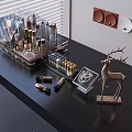 Luxury Perfume Cosmetics Display with Transparent Rack Gold Elements and Deer Ornament on Black Tabletop