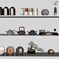 Traditional Ceramic Tea Set Display On Shelves With Various Teapots Storage Jars And Decorative Plates