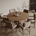 Modern Round Wooden Dining Table Set With Six Light Upholstered Chairs And Greenery Decor