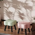 Light Green And Pink Accent Chairs With Black Spherical Legs On Wooden Floor