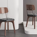 Modern Minimalist Single Chair Featuring Walnut Wood Frame Black Leather Seat And Metal Accents