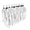 White Shirts Hanging on Hangers in a Row Against Black Background