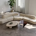 Soft Beige Curved L Shaped Sofa and Coffee Table Set with Sunlight and Green Plant