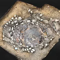 Natural Circular Stone Enclosed Depression With Muddy Ground And Water Puddles