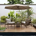 Serene Courtyard Garden With Wooden Deck Rattan Chairs Beige Umbrella Green Plants And Small Pool
