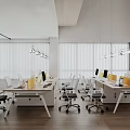 Modern Open Public Office Space With Long Desks Chairs Yellow Dividers Large Windows Hanging Lights