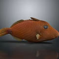 Decorative Orange Fish Figurine With Textured Body And Black Eyes For Home Decor