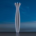 Modern Illuminated Light Pole With Blue Sky Background And Ground Reflection