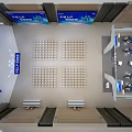 Modern Exhibition Hall Interior With Seating Rows And Blue Digital Screens 3d model