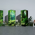 Floral Installation Featuring Three Forest Themed Display Pillars and Surrounding Flowers Green Plants