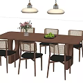 Modern Wooden Tea Table And Rattan Chairs With Dark Cushions Decorative Vase And Hanging Lights