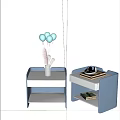 Modern Bedside Table With Vase Balloons Hat And Stacked Books On Shelf
