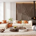 Modern Sofa And Coffee Table Set With Beige Upholstery Orange Pillows Textured Wall And Fireplace