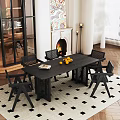 Modern Restaurant Interior With Black Dining Table Chairs Fireplace Artwork Checkerboard Rug And Oranges