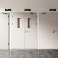 White Emergency Exit Doors With Green Signs And Glass Windows In Building Interior