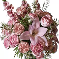Pink Roses And Lilies Arrangement In Glass Vase With Metallic Base And Green Leaves