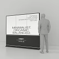 Business Professional Observing Large Billboard Featuring Minimalist Organic Balanced Medical Petrochemical Themes