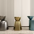 Modern Gray Beige Blue Stools With Different Designs On Vertical Striped Wall And Wooden Floor