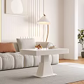 Modern White Coffee Table With Sofa Pillows Floor Lamp And Potted Plant On Wooden Floor