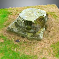Weathered Stone Structure With Mossy Surface On Green Grass Outdoor Area 3d model