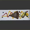 Delicious Caramel Cake Slice Served On White Plate With Colorful Sauce And Fresh Blueberries