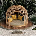Landscape Seating With Wicker Dome Structure Yellow And Blue Cushions Surrounded By Green Plants And Wooden Platform