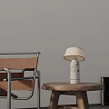 Marble Table Lamp On Wooden Side Table With Brown Leather Chair In Modern Living Space