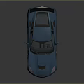Blue Sports Car With Aerodynamic Design Rear Spoiler Sleek Body And Alloy Wheels