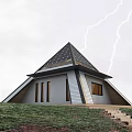 Scenic Lakefront A frame Cabin with Solar Panels Wooden Deck and Yellow Chairs